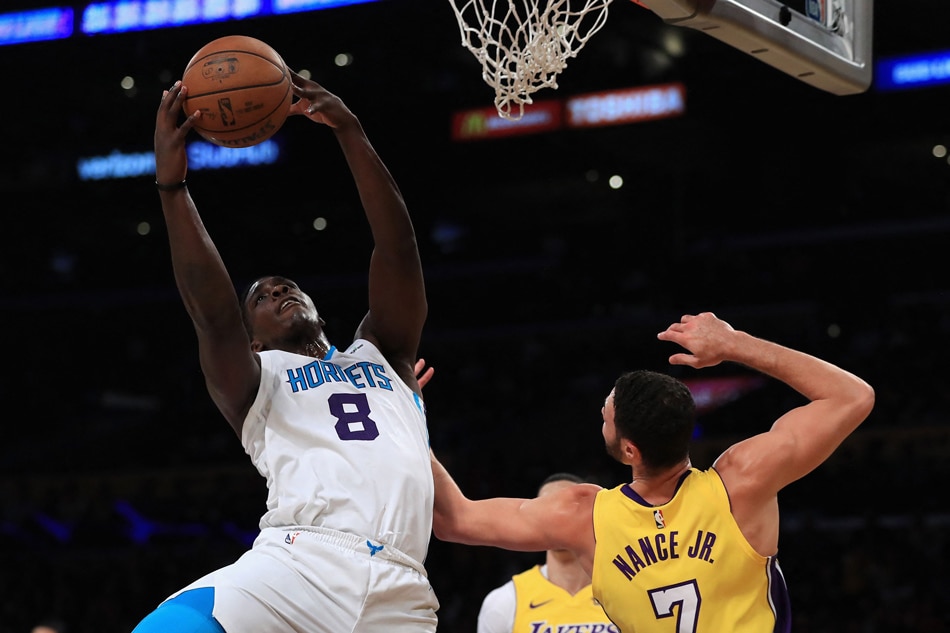 Johnny O'Bryant III (8) of the Charlotte Hornets reboounds over Larry Nance Jr. (7) of the Los Angeles Lakers at Staples Center in this file photo. Sean M. Haffey, Getty Images/AFP