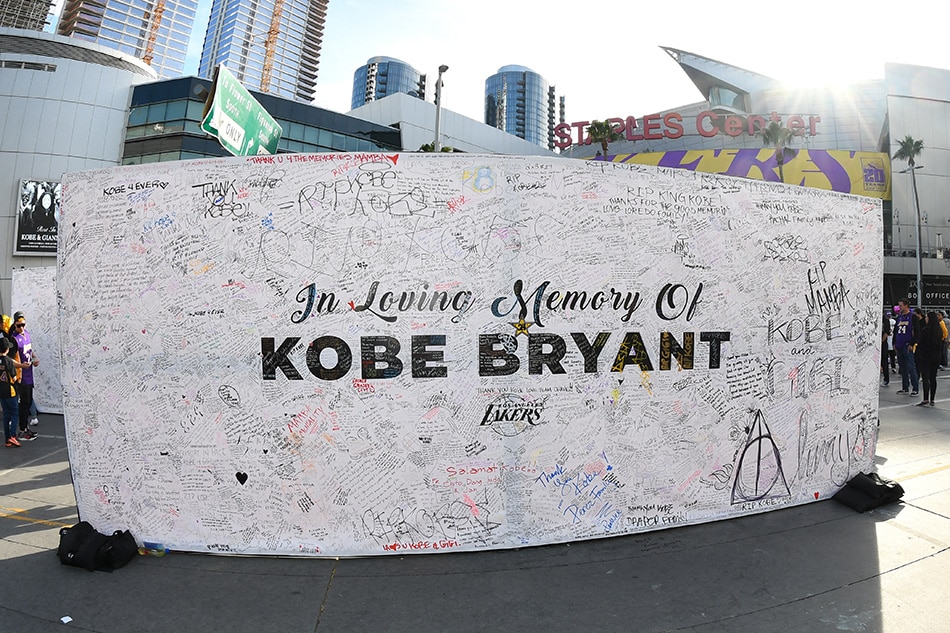 Fans honor Kobe Bryant outside Staples Center on January 31, 2020, in Los Angeles. Adam Pantozzi, NBAE via Getty Images/AFP/file