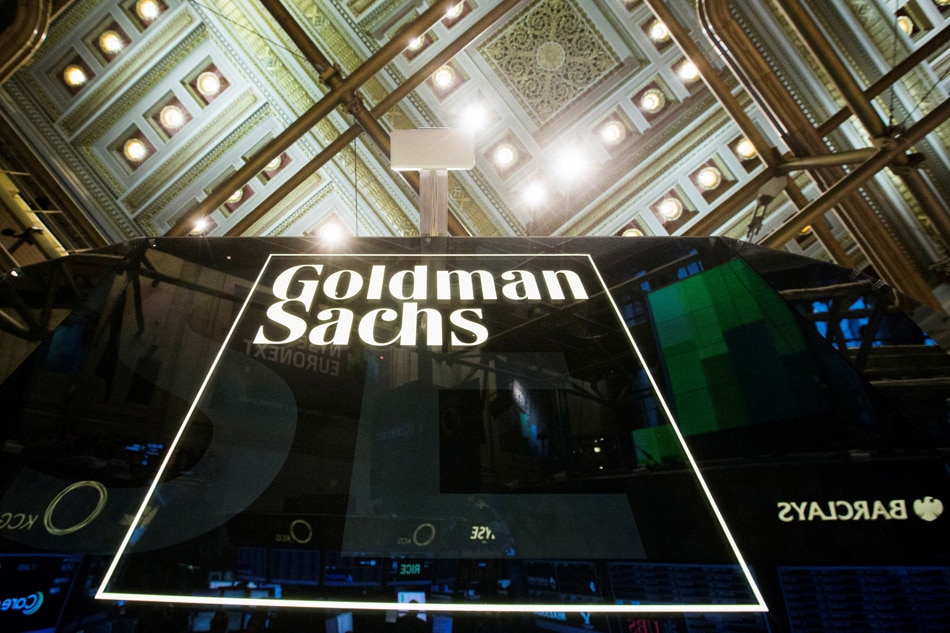 A Goldman Sachs sign is seen above the floor of the New York Stock Exchange , January 24, 2014. REUTERS/Lucas Jackson/File Photo