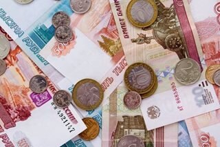 Russian ruble tanks almost 30 pct after latest sanctions