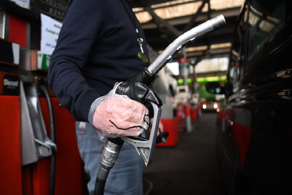 A man fills his car with fuel in London, Britain, February 24, 2022. Average UK petrol and diesel prices have hit new highs as the Ukraine crisis continues to affect oil prices. Neil Hall, EPA-EFE