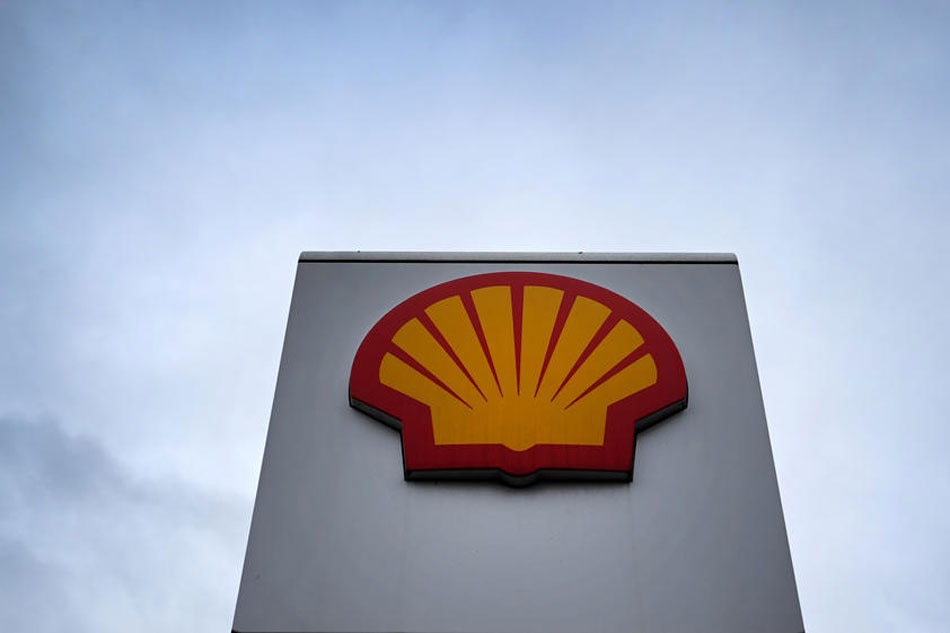 A Royal Dutch Shell sign is seen at a petrol station in London, Britain, Feb. 3, 2022. Energy giant Shell has seen its quarterly profits increase fourteen-fold amid soaring oil and gas price over the last quarter of 2021. Andy Rain, EPA-EFE/File 