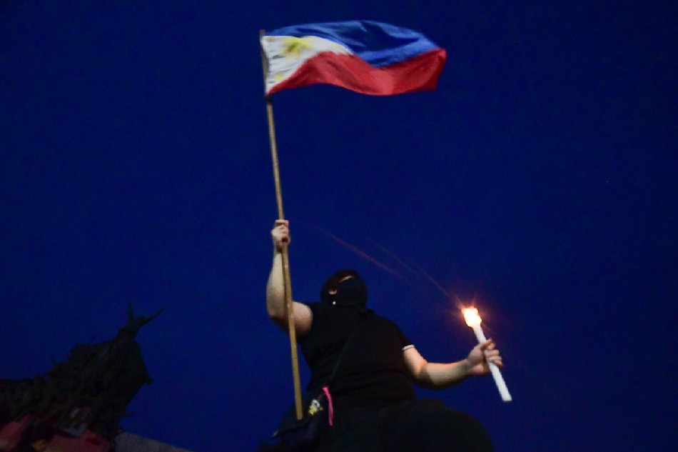 Human rights advocates commemorate the EDSA People Power Revolution in Quezon City on February 20, 2022, days before its anniversary on February 25. Mark Demayo, ABS-CBN News/file