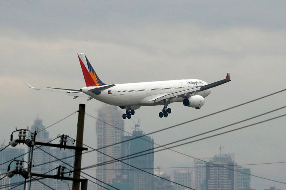 A Philippine Airlines plane lands at Manila's international airport, Philippines, 09 April 2108. Francis Malasig, EPA-EFE/File