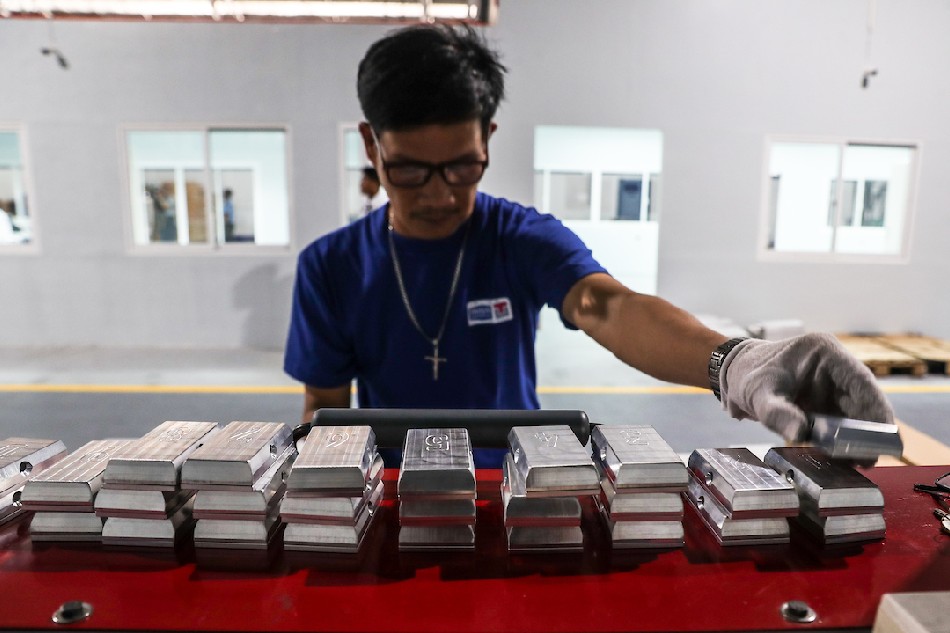 A staff worker operates a hot-foil printing machine as he produces plate numbers at the Land Transportation Office (LTO) plate-making plant/assembly line in its headquarters in Quezon City. Jonathan Cellona, ABS-CBN News