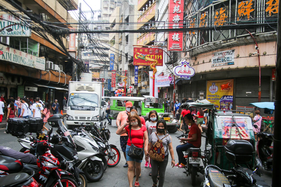  People visit shops along Binondo, Manila on Chinese New Year, February 1, 2022 as Metro Manila is put under the looser Alert Level 2 restriction with COVID-19 cases declining steadily. Jonathan Cellona, ABS-CBN News/File