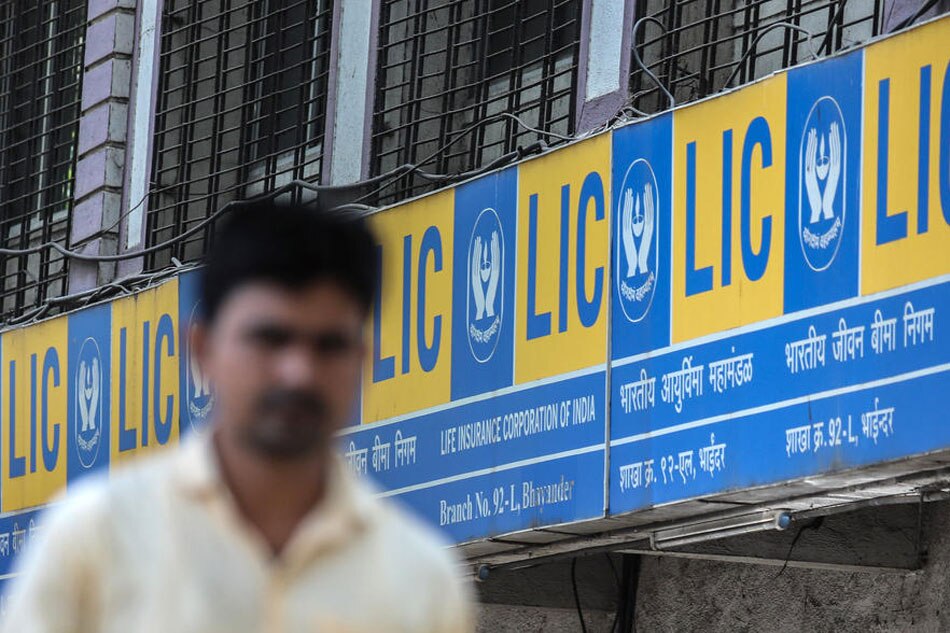 A man walks past a Life Insurance Corporation (LIC) branch office in Bhayander, outskirts of Mumbai, India, 04 May 2022. India’s largest-ever Initial Public Offering (IPO) of LIC, opened for subscription on 04 May and will close on 09 May. Divyakant Solanki, EPA-EFE/File