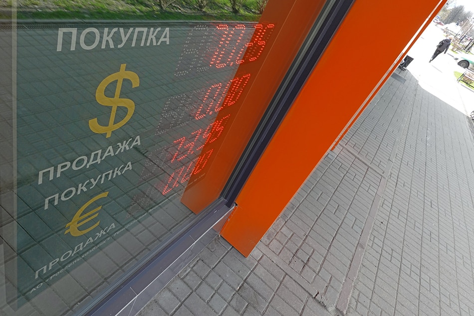 An electronic panel displays currency exchange rates for US dollar and euro against Russian ruble at currency exchange office in Podolsk, outside Moscow, Russia, 29 April 2022. MAXIM SHIPENKOV, EPA-EFE