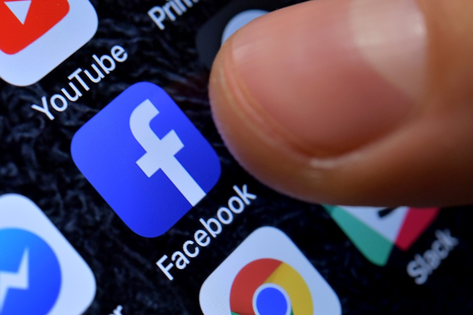 A close-up image showing the Facebook app on an iPhone in Kaarst, Germany, 08 November 2017 (reissued 30 October 2019). Sascha Stenbach, EPA-EFE/File