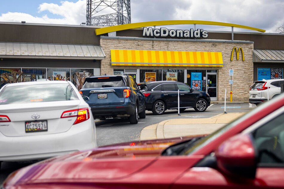 The drive-thru lunch line at a McDonalds restaurant extends into the street in Bethesda, Maryland, USA, 12 April 2022. Jim Lo Scalzo, EPA-EFE/File