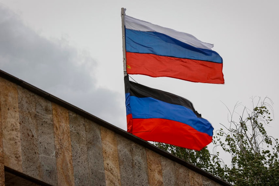  The flags of Russia (up) and the self-proclaimed Donetsk People's Republic (below) fly over the city administration building of Svitlodarsk, Donetsk region, Ukraine, May 26, 2022. Alessandro Guerra, EPA-EFE