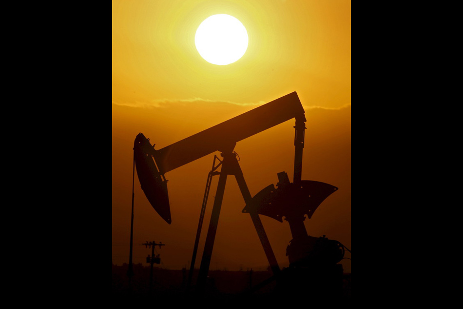 A file photograph showing an oil well-pumping oil in an oil field near Ponca City, Oklahoma USA, 14 November 2007. Larry Smith, EPA-EFE/File