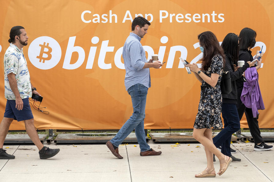 People arrive to attend the Bitcoin 2022 Conference, at the Miami Beach Convention Center in Miami Beach, Florida, USA, 06 April 2022. CRISTOBAL HERRERA-ULASHKEVICH, EPA-EFE/File