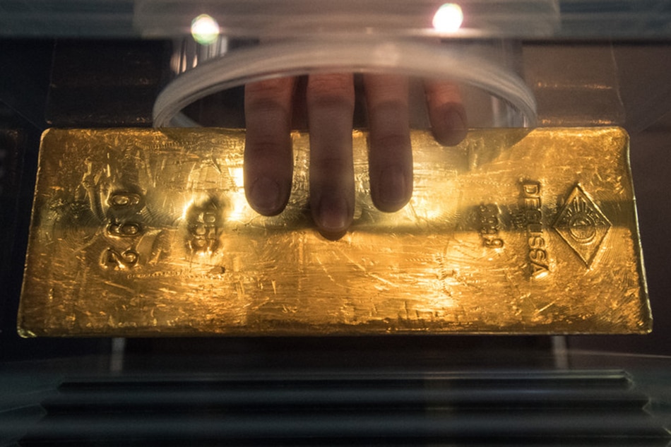 This bar of gold weighs 12.5 kilograms, seen at the newly opened Museum of money of the German Federal Bank in Frankfurt, Germany, 15 December 2016. Boris Roessler, EPA