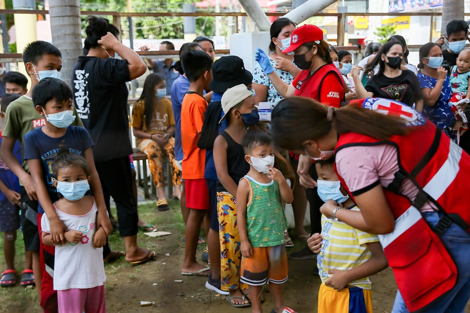 Children receive hygiene kits after a briefing on handwashing for residents currenlty staying at the Abra Provincial capitol grounds on July 28, 2022 Jonathan Cellona, ABS-CBN News