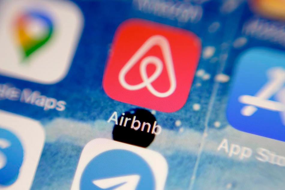 A photo illustration shows the app icon of US online rental vacation company Airbnb (C) displayed on a mobile phone in Oestrich-Winkel, Germany, 04 February 2021 (issued 05 February 2021). EPA-EFE/MATTIA SEDDA