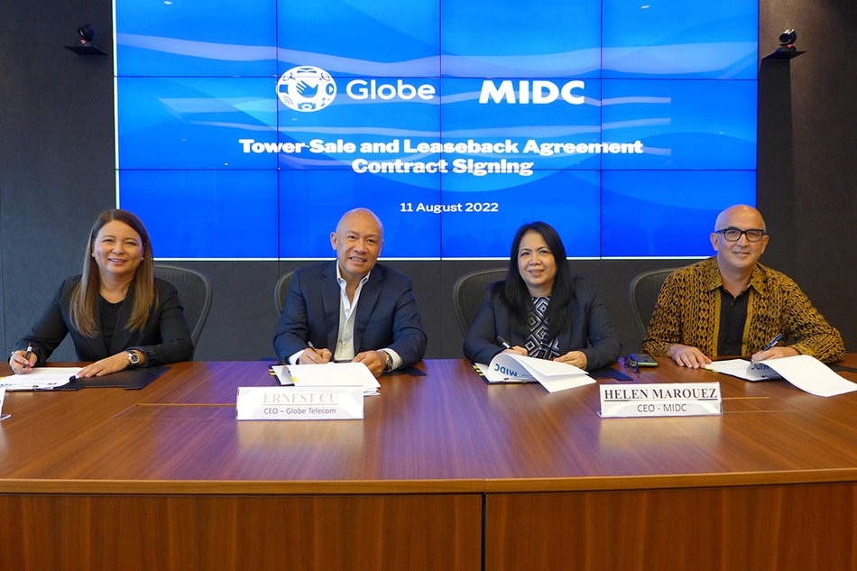 Globe and MIDC officials sign the first of the 3 tower asset portfolio. Handout