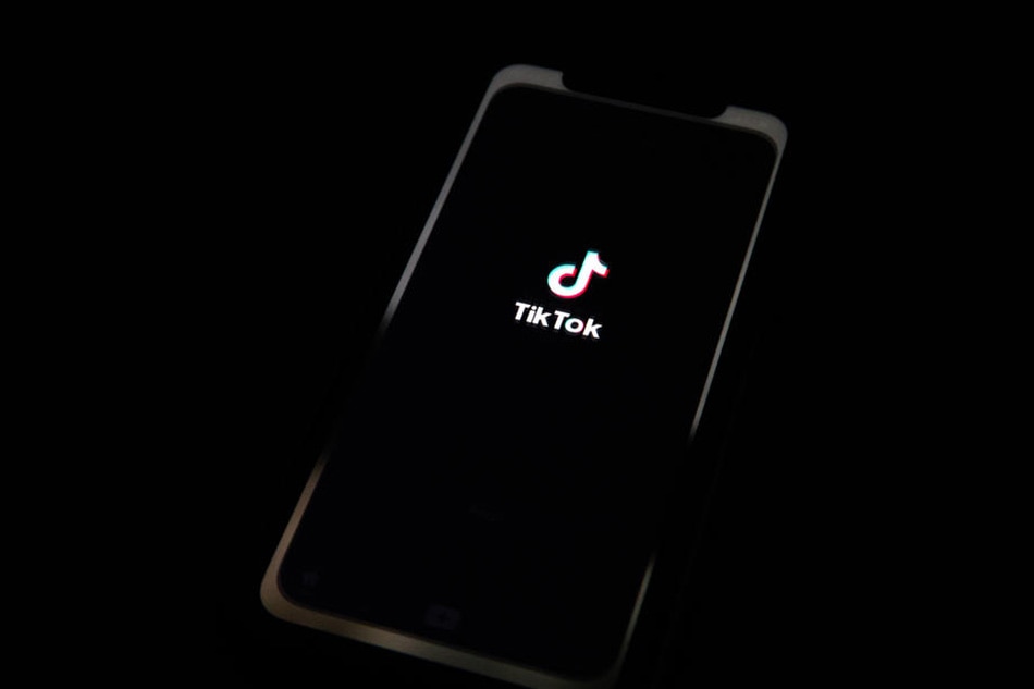A generic illustration shows the logo of Chinese internet media app TikTok on a phone, in Beijing, China, 21 September 2020. Chinese-owned mobile app WeChat was set to stop operation in the U.S. on midnight 20 September 2020. EPA-EFE/ROMAN PILIPEY