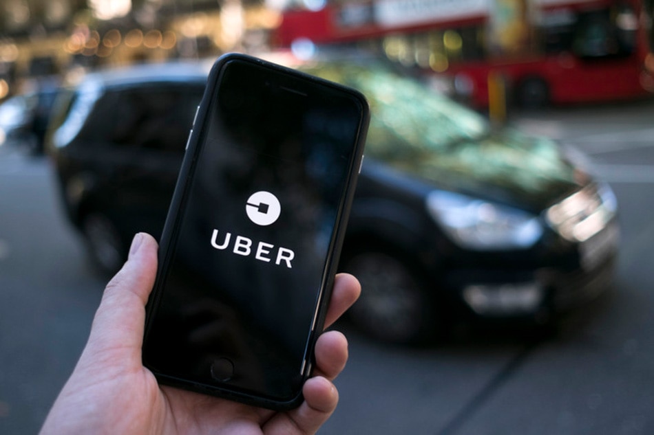 An Uber logo on a mobile telephone in central London, September 22, 2017. Will Oliver, EPA-EFE/file