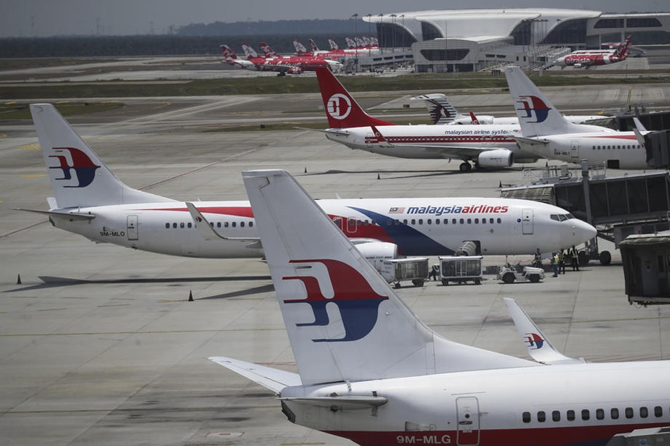 Malaysia Airlines aircrafts are parked on the tarmac at Kuala Lumpur International Airport in Sepang, Malaysia, September 7, 2020. Fazry Ismail, EPA-EFE/file