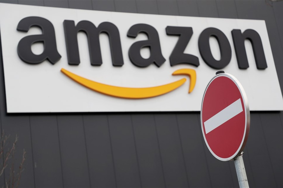 The Amazon logo is pictured outside the company's logistic and distribution center in Werne, Germany, November 22, 2018. Friedemann Vogel, EPA-EFE/file