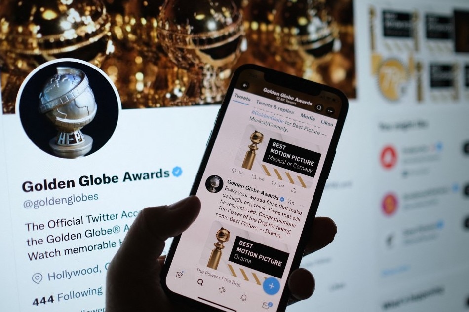 This illustration photo shows a person checking the Golden Globe Awards online via the Golden Globes Twitter account, in Los Angeles. Chris Delmas, AFP