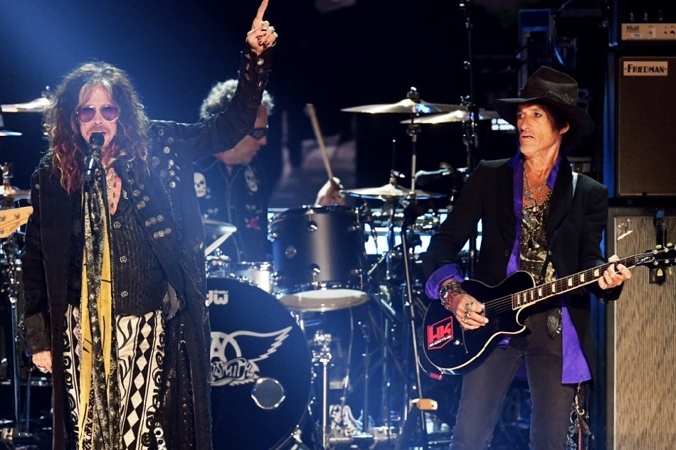 Steven Tyler and Joe Perry of music group Aerosmith perform onstage during the 62nd Annual Grammy Awards in this January 26, 2020 file photo. Kevin Winter, Getty Images for The Recording Academy /AFP