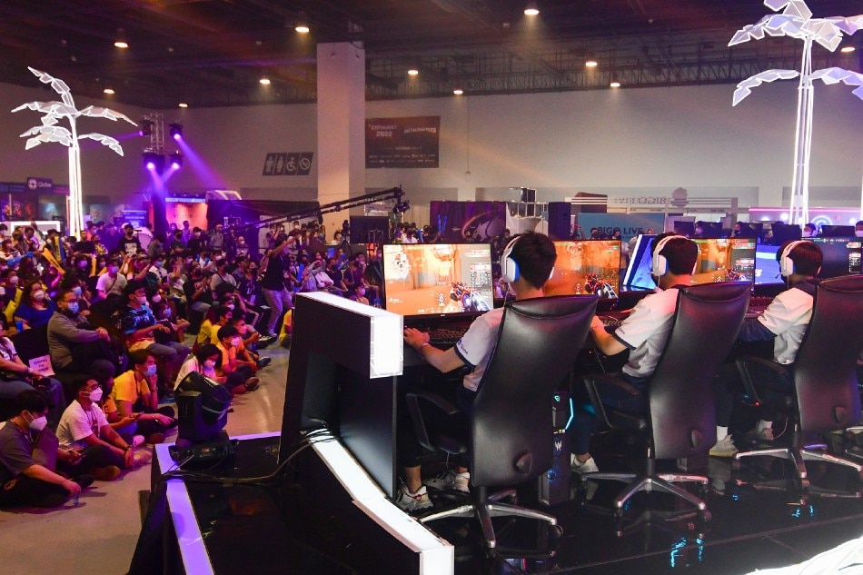 Visitors flock to the second day of CONQuest Festival, a weekend-long experience of gaming, technology, anime, and pop culture, in Pasay City on July 24, 2022. The festival featured various college esports matches, distinguished creators, cosplay, displays, and booths. Mark Demayo, ABS-CBN News.