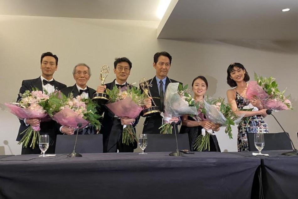 The creators and actors of 'Squid Game' pose during a news conference after director Hwang Dong-hyuk (third from left) won the award for Outstanding Directing for a Drama Series and actor Lee Jung-jae (third from right) won the award for Outstanding Lead Actor in a Drama Series during the 74th Emmy Awards on September 12, 2022. Yonhap South Korea Out/EPA-EFE