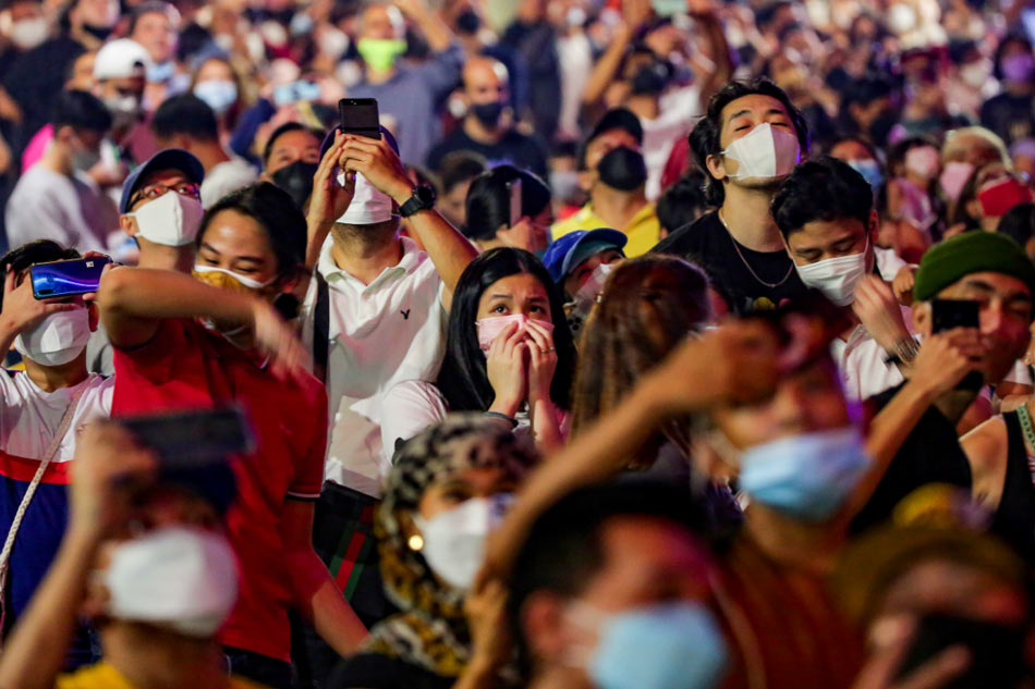 Revelers watch a fireworks display George Calvelo, ABS-CBN News/file