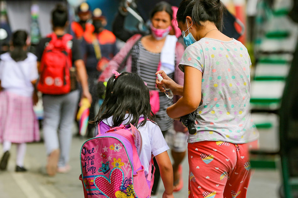 Students observe safety protocols inside the Ricardo P. Cruz Sr. Elementary School in Taguig City, during the first day of the pilot face-to-face classes in the National Capital Region on Dec. 6, 2021. Jonathan Cellona, ABS-CBN News