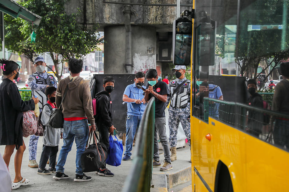 Commuters prepare to board a bus ABS-CBN News