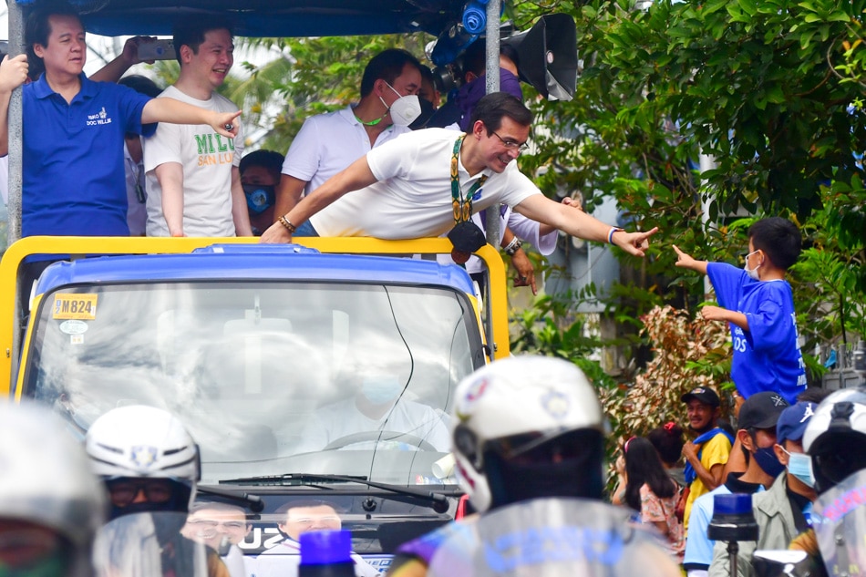 Presidential candidate Manila Mayor Isko Moreno Domagoso and his running mate Dr. Willie Ong greet supporters during a campaign event in Santa Maria, Laguna on February 10, 2022. Mark Demayo, ABS-CBN News 