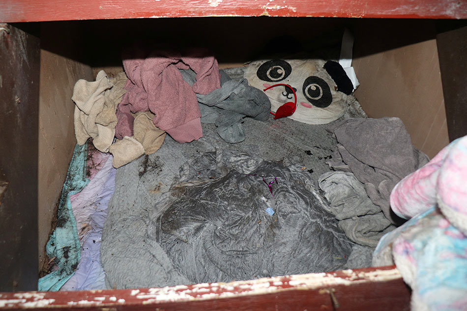 View of a makeshift room underneath a staircase Reuters
