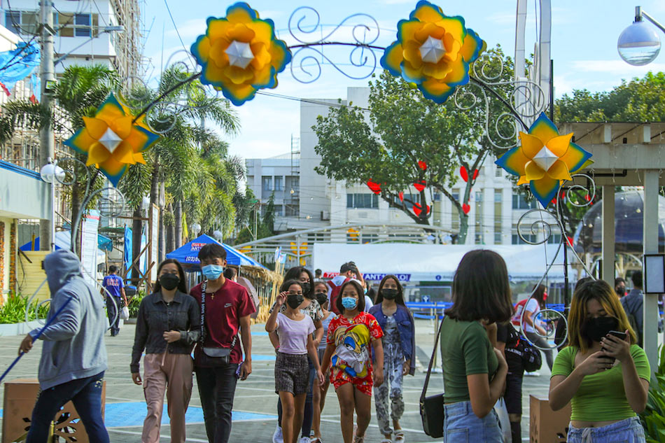 People take a stroll at a public square ABS-CBN News
