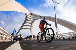 Light traffic brings cyclists to new Manila bridge