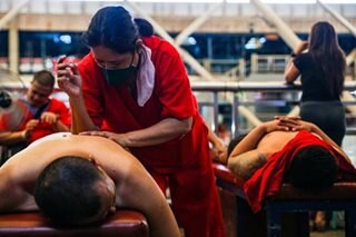 Blind massage therapists offer service in Pasig market