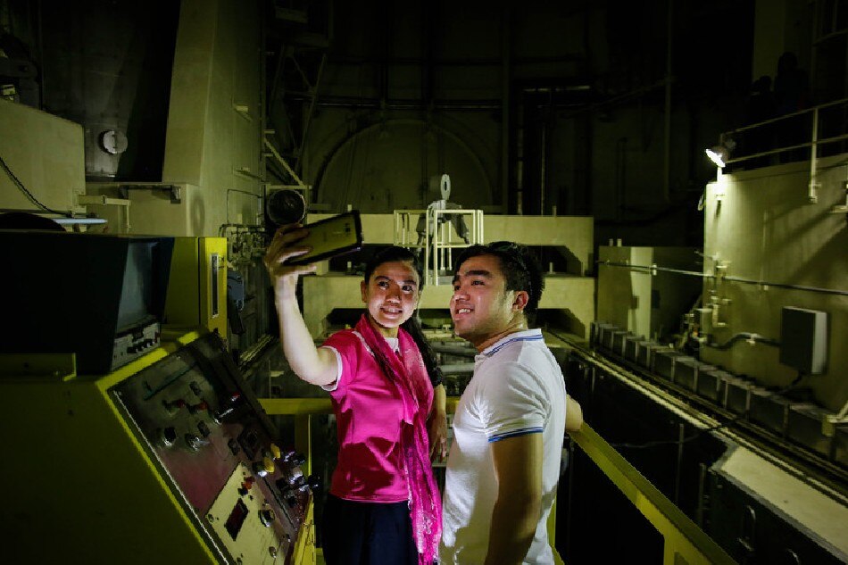 Journalists take selfies near the nuclear reactor inside the Bataan Nuclear Power Plant in Morong, Bataan Province, north of Manila, Philippines, Sept. 16, 2016. Lawmakers visited the Bataan Nuclear Power Plant (BNPP) in a bid to look for alternative energy to help solve the shortage of power supply in the country. Mark R. Cristino, EPA/File