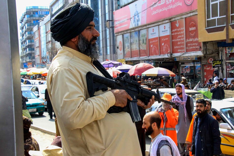 A Taliban stands guard EPA-EFE