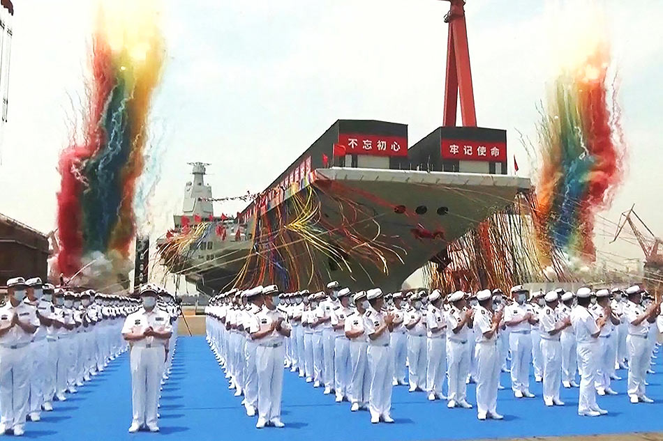 This screen grab made from video released by Chinese state broadcaster CCTV shows the launch ceremony of the Fujian, a People's Liberation Army (PLA) aircraft carrier, at a shipyard in Shanghai on June 17, 2022. China on June 17 launched its third aircraft carrier, the first designed and built entirely in the country, marking a major military advance for the Asian superpower. CCTV / AFP