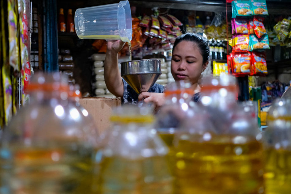Selling cooking oil at Pasig Mega Market