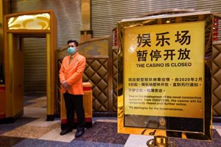 Macau closes casinos, businesses as COVID outbreak worsens