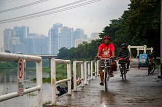 Cycling by the Marikina River