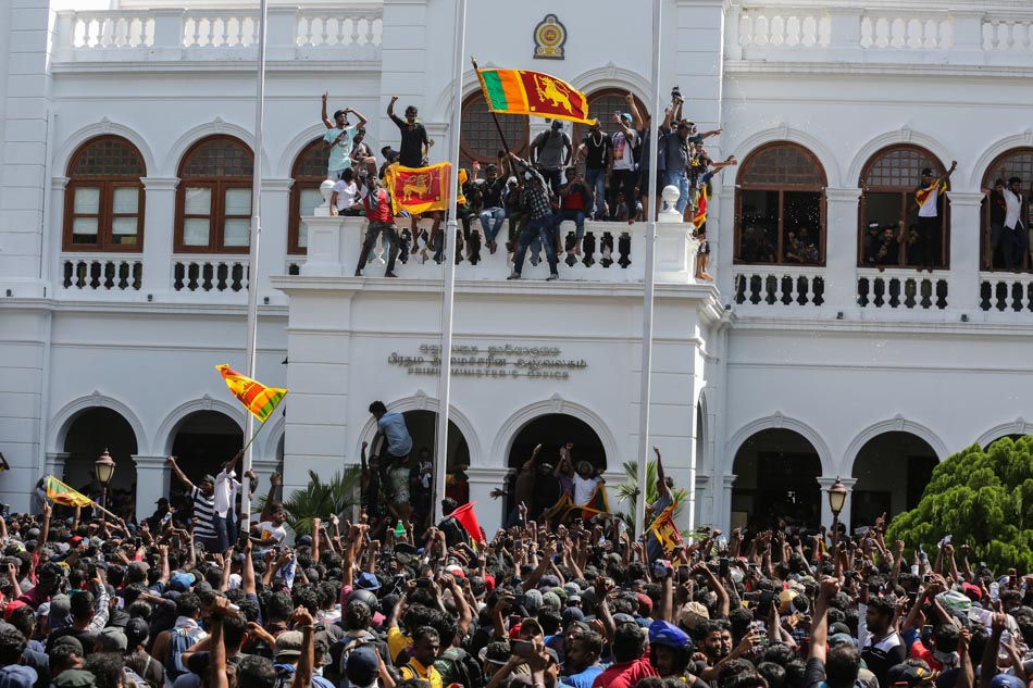  People protesting the economic crisis celebrate after storming the Prime Minister's office in Colombo, Sri Lanka on July 13, 2022. Chamila Karinarathne, EPA-EFE