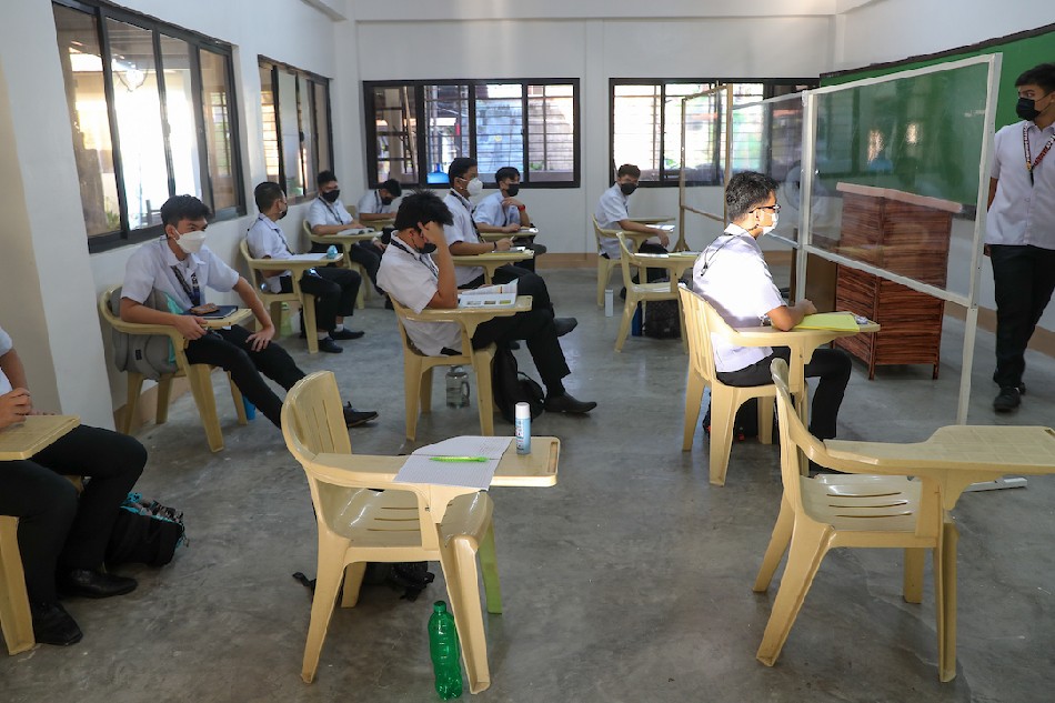 Students attend the pilot implementation of face-to-face classes at Mother of Good Counsel Seminary in San Fernando, Pampanga on November 22, 2021 as it reopens for a limited number of pupils. Jonathan Cellona, ABS-CBN News/file