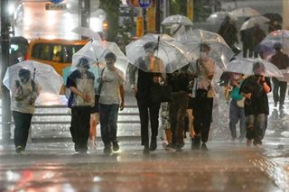 Japan logs record daily 255,000 COVID-19 cases