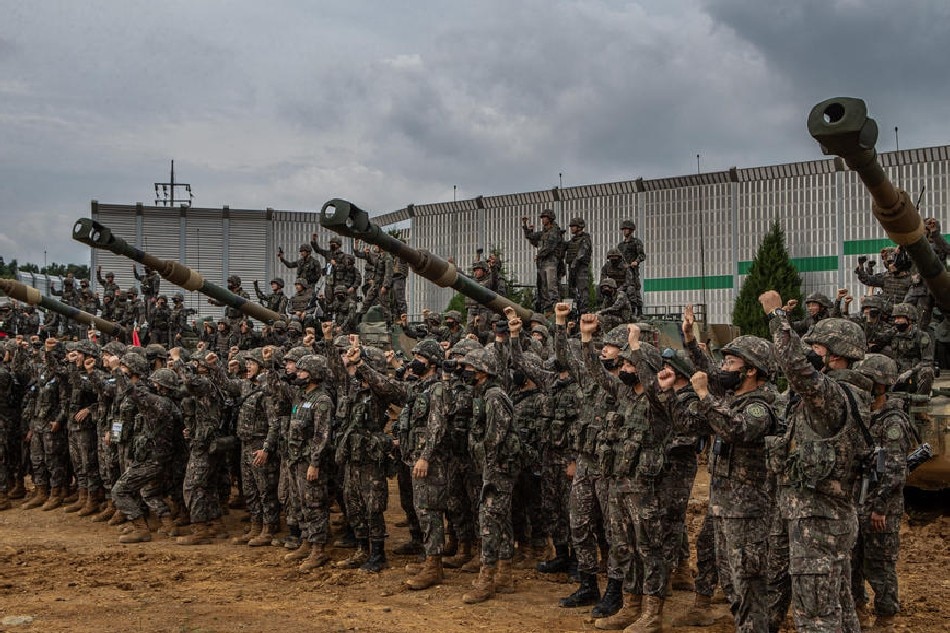 Soldiers of the South Korea Army's 28th Division pose for a photo after conducting an artillery live-fire drill with K55A1 and K9 self-propelled howitzers at an army training range in Pocheon, north of Seoul, South Korea, Aug. 19, 2022. The military exercise was held to mark the seventh anniversary of the 2 Koreas' shelling across the inter-Korean border on 20 August 2015. EPA-EFE/Yonhap 
