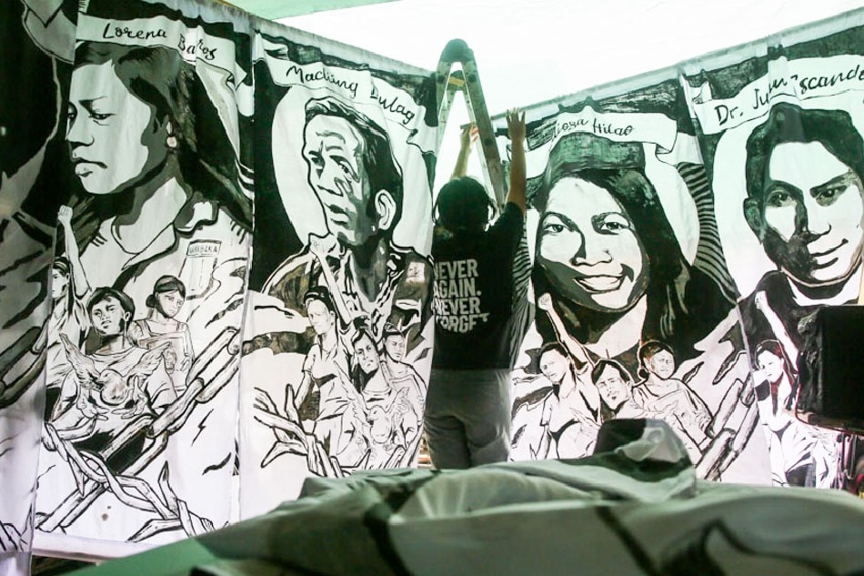 Members of Karapatan prepare banners at their headquarters in Quezon City on Tuesday, in preparation for the 50th anniversary of the declaration of Martial Law on September 21, 2022. Jonathan Cellona, ABS-CBN News