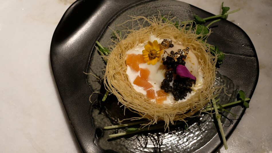 Everything in the Egg Nest dish is edible, and breaking the nest of crispy rice noodles and letting that absorb the poached egg with salmon and 20-year Imperial caviar make for a refined bite. Jeeves de Veyra