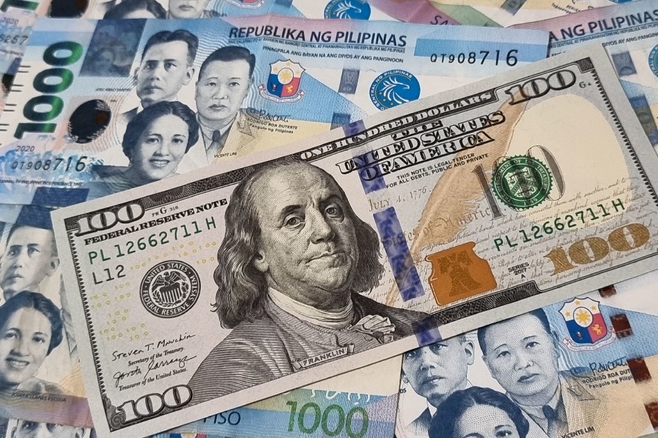 Photo illustration of US dollar to PH peso exchange in this photo taken on September 30, 2022. Gigie Cruz, ABS-CBN News
